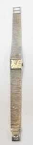 An Omega 9ct white gold lady's wristwatch, the silvered square watch head with baton dial, and... - 2