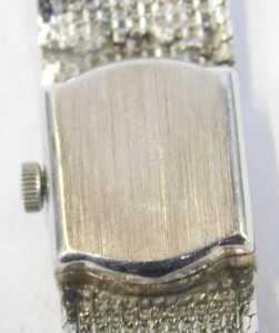 An Omega 9ct white gold lady's wristwatch, the silvered square watch head with baton dial, and... - 3