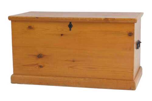 A 20thC pine blanket box, the hinged top with a moulded edge, enclosing a vacant interior with...