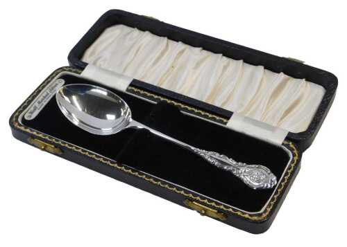 An Elizabeth II silver Christening spoon, the terminal decorated with a scrolling border and...