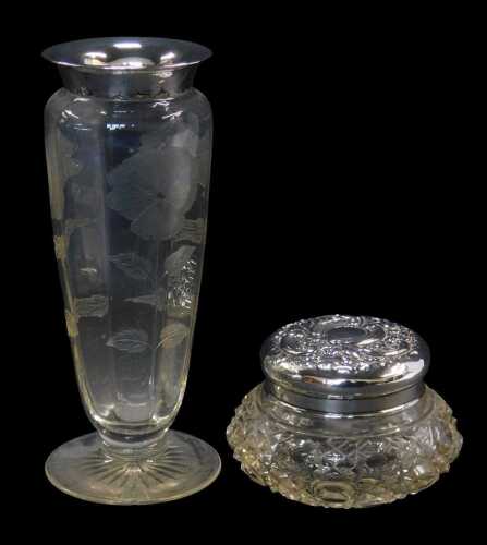 An Edward VII silver mounted and cut glass powder jar, the lid repousse decorated with flower...