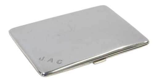 A George V silver cigarette case, of plain form, initialled to the exterior JAG and inscribed to...