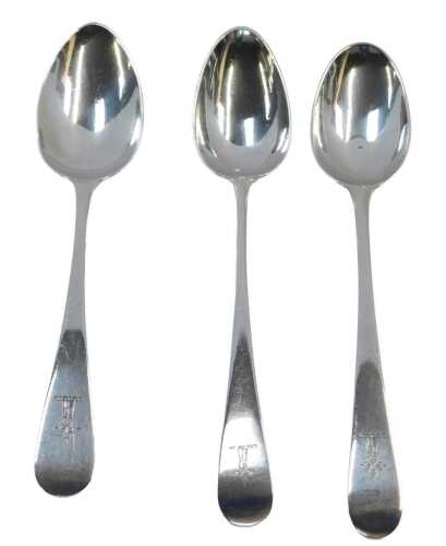 Three harlequin silver Old English pattern dessert spoons, crest engraved, London 1787, 1829,...