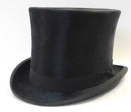 An early 20thC moleskin top hat, bearing a label to the interior, Best Quality London.