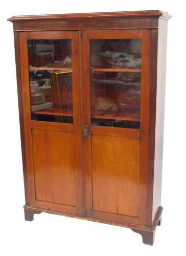 A 19thC Continental mahogany cabinet, with glazed and panelled doors, on bracket feet, 157cm...