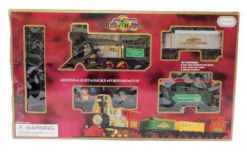 A Rocky Mountain battery operated train set, including locomotives, caboose, and other rolling...