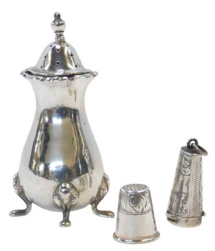 An early 20thC silver pepper pot, of baluster form, raised on four pad feet, Chester, year mark...