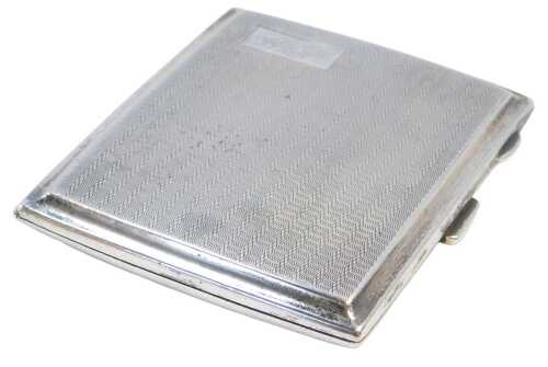 A George V silver cigarette case, with engine turned decoration, rectangular reserve, monogram...