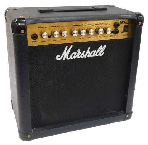 A Marshall MD 15 DFX portable guitar amp.