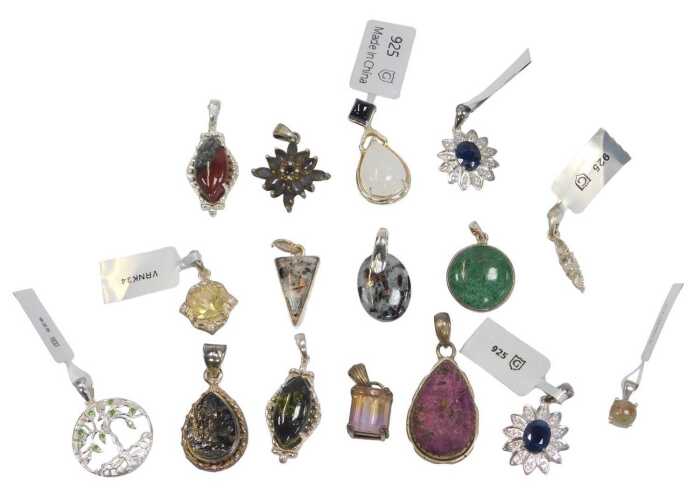 A quantity of pendants, to include silver stone and floral clusters, rough cut, agate, and...