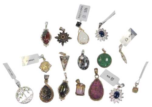 A quantity of pendants, to include silver stone and floral clusters, rough cut, agate, and...