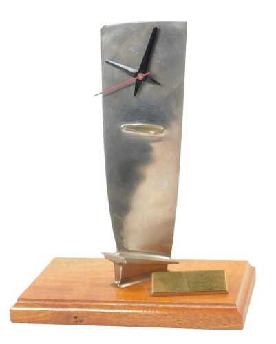 An aeroplane rotor arm, converted to a clock, with quartz movement, on a mahogany base, with...