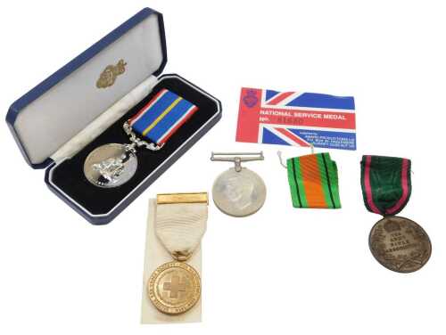 A quantity of medals and medallions, to include a National Service 1939-1960 medal, Red Cross...