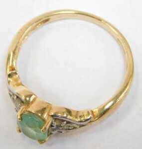 An 18ct gold emerald and diamond dress ring, the oval emerald in a four claw setting, with tiny... - 2