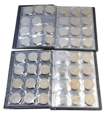 A folder containing forty one commemorative and other fifty pence coins, and a further folder of...