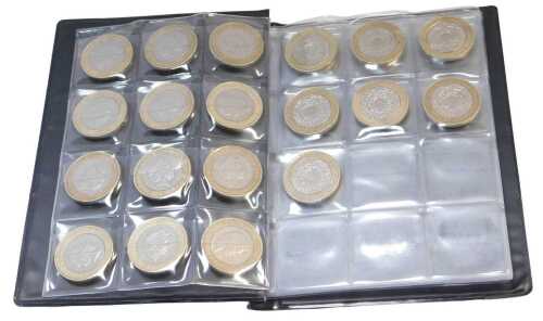 A collection of nineteen commemorative two pound coins, and four one pound coins.