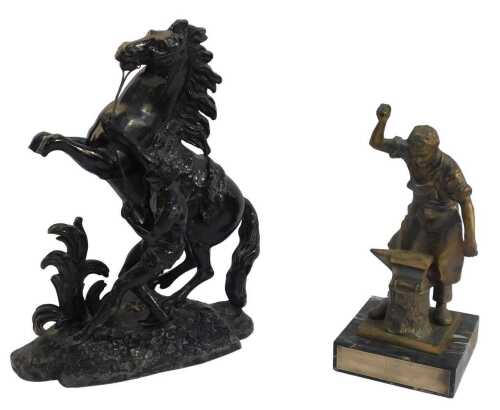 A late 19thC black painted spelter Marley horse, 42cm high, and a trophy showing a blacksmith,...