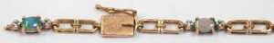 An opal and diamond line bracelet, with a two-sectional link bracelet, yellow metal stamped 9ct,... - 2