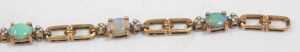 An opal and diamond line bracelet, with a two-sectional link bracelet, yellow metal stamped 9ct,... - 4
