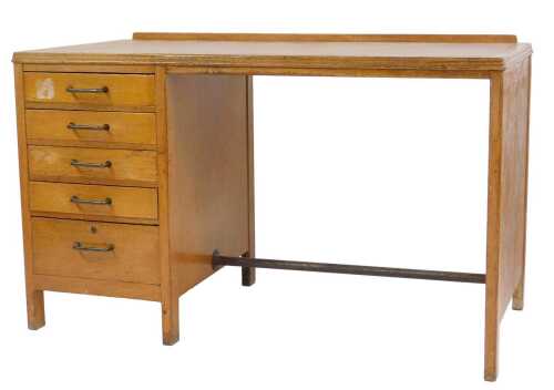 A mid century Ministry of Defence oak desk, the top with a raised back and inset with a faux...
