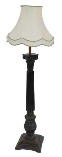 A late 18thC/ early 19thC ebonised oak standard lamp, with Corinthian capital, a fluted column...