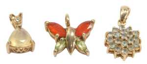 Three 9ct gold pendants, comprising a forty stone set butterfly pendant, 1.5cm wide, a light...