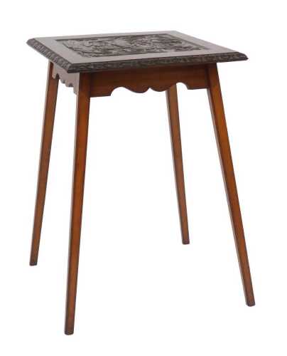 An early 20thC mahogany occasional table, the top with a carved panel and a carved border,...