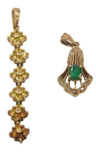 Two 9ct gold pendants, comprising an emerald and cz fan design pendant, 2.5cm high, and a...