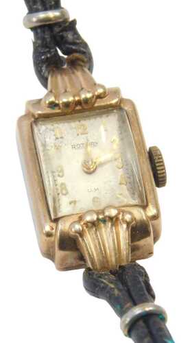 A 9ct gold cased Rotary lady's wristwatch, the rectangular watch head, on a cream dial with...