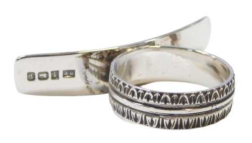 A silver orange peeler ring, the attachment of plain design, on a brushed band, maker DP,...