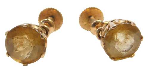 A pair of early 20thC citrine set screw-back earrings, each with a round brilliant cut citrine,...