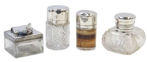 Three silver topped glass scent bottles, one initialled to the lid, together with a silver...