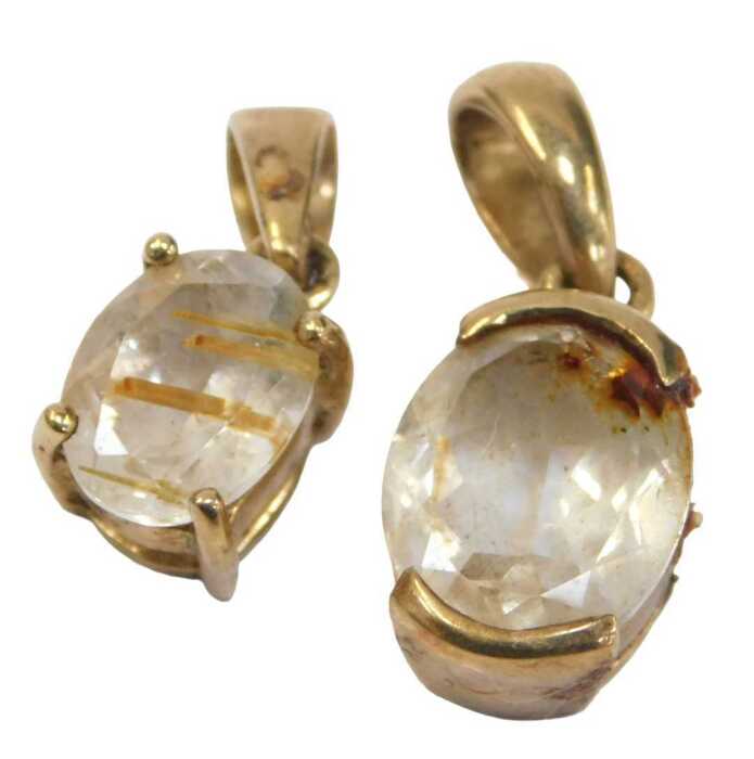 Two 9ct gold pendants, each set with clear paste stones, 2cm high, 4g all in.