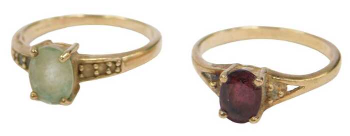 Two 9ct gold dress rings, comprising one single stone set with a garnet, size N&frac12;, and another...