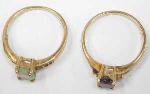 Two 9ct gold dress rings, comprising one single stone set with a garnet, size N&frac12;, and another... - 2