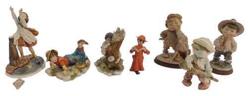 A group of Capodimonte figures, to include a boy firing a pea shooter beside a rock, Naples mark...