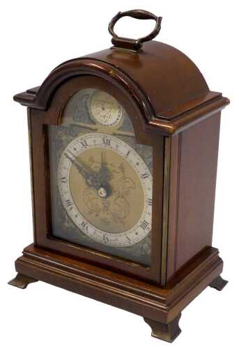 An Elliott mantel timepiece, retailed by Garrard and Co Limited, in a walnut case, 19cm high.