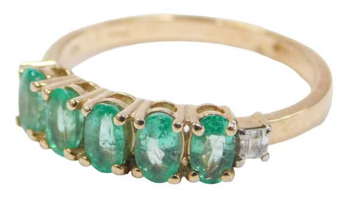 A 9ct gold dress ring, set with five oval cut emeralds and two square cut czs, ring size Q, 2.3g...