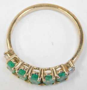 A 9ct gold dress ring, set with five oval cut emeralds and two square cut czs, ring size Q, 2.3g... - 2