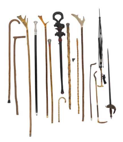 A group of walking sticks, to include a Malacca walking cane with white metal mount, other...