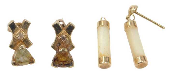 Two pairs of 9ct gold earrings, comprising a pair of cross and bow stone set studs, one stone...