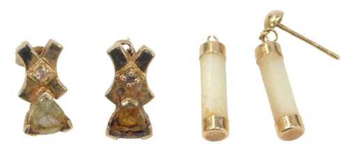 Two pairs of 9ct gold earrings, comprising a pair of cross and bow stone set studs, one stone...