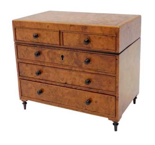 A 19thC burr walnut novelty writing chest, the hinged lid enclosing two ink pots, the front with...