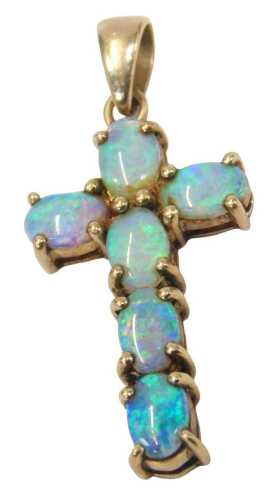 A 9ct gold opal pendant cross, set with six oval opals, 3.5cm high, 2.1g all in.
