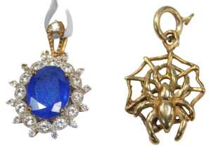 Two 9ct gold pendants, comprising a 9ct gold spider's web and spider, 1.5cm wide, and a 9ct gold...
