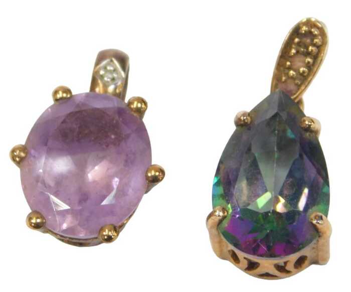 Two 9ct gold pendants, comprising one set with an oval cut amethyst and diamond, 2cm high, and a...