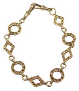 A watch chain bracelet, formed as diamonds and circles, each with scroll hammering, with two...