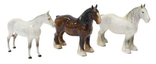 Three Beswick pottery horses, comprising a dapple grey, 20cm high, a dapple grey shire horse,...