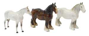 Three Beswick pottery horses, comprising a dapple grey, 20cm high, a dapple grey shire horse,...