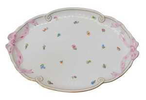 A Herend porcelain tray, decorated with two pink bow handles and floral sprays, within a basket...